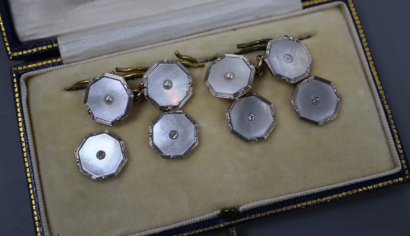 A set of four 18ct and plat, mother of pearl and diamond set dress studs and a pair of 9ct and mother of pearl cufflinks.